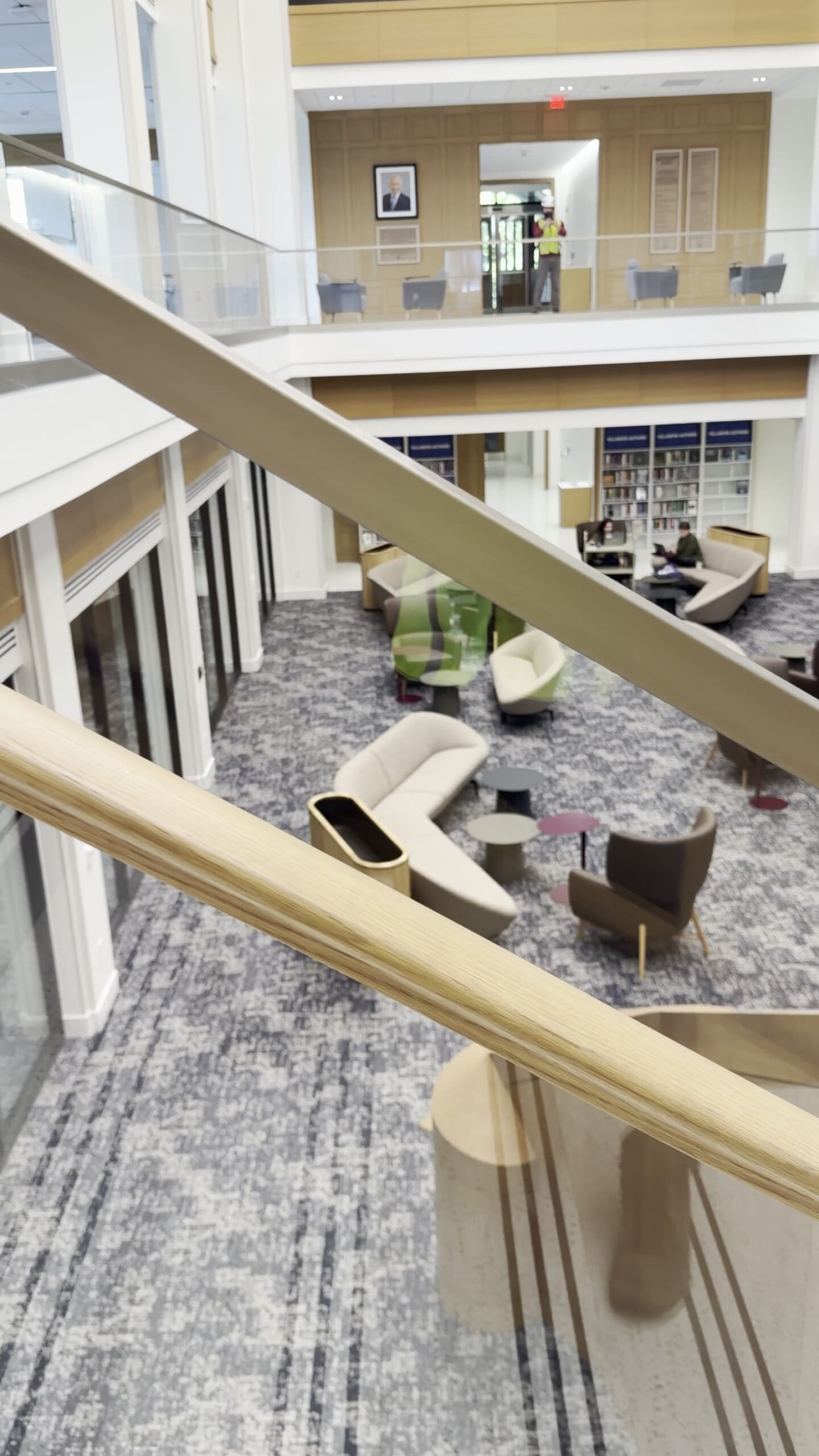 Stair glass guardrail with handrail mounted on glass brackets